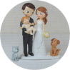 Figura de novios con bebe en brazos